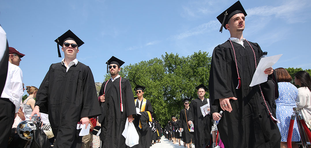 male graduates processing