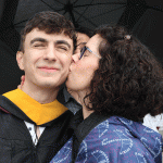 Mom kissing grad